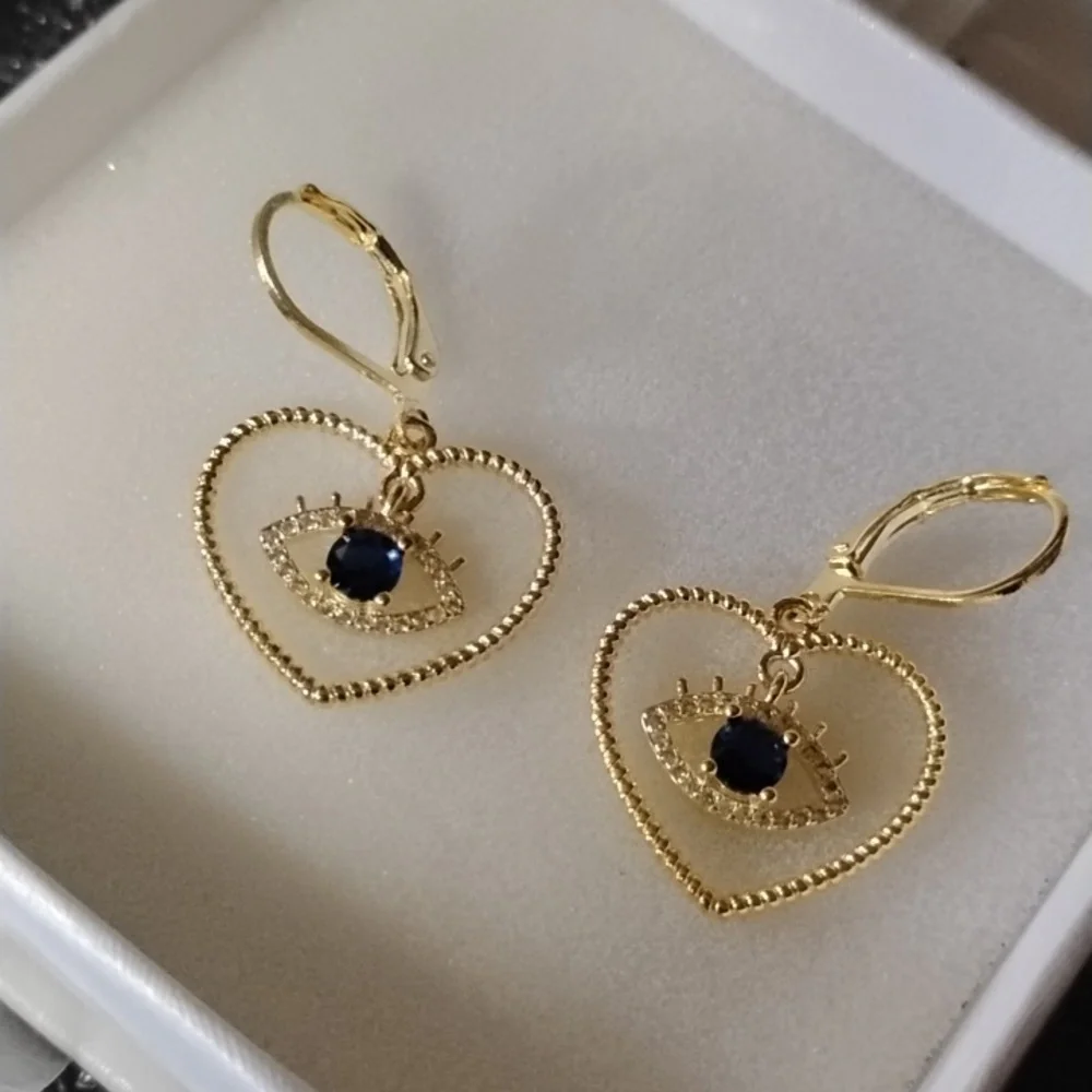 Gold Tone Heart Eye Earrings